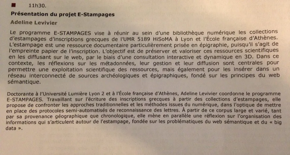 Photograph of a printed conference program page describing the E-STAMPAGES project presentation, in French.